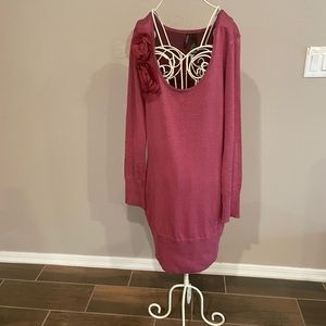 This cute sweater dress is made by bisou bisou